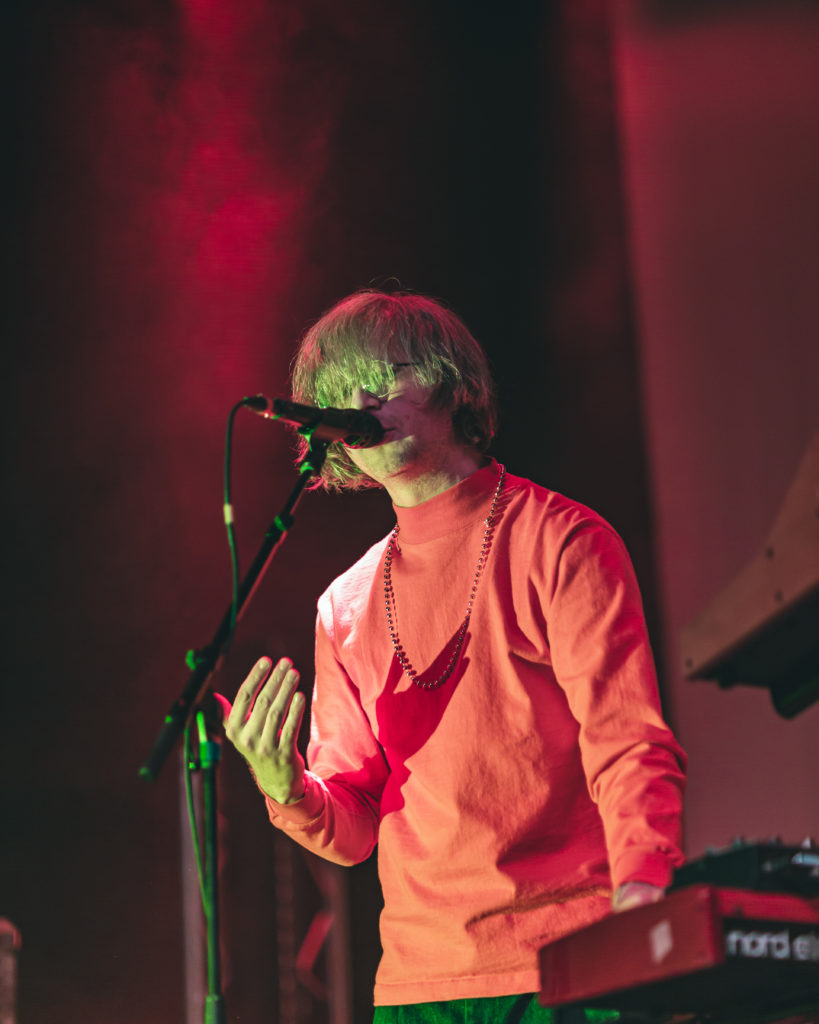 Vocalist for Parquet Courts performing onstage in Brooklyn